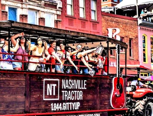 Group of women riding on the Nashville Tractor wagon through downtown.